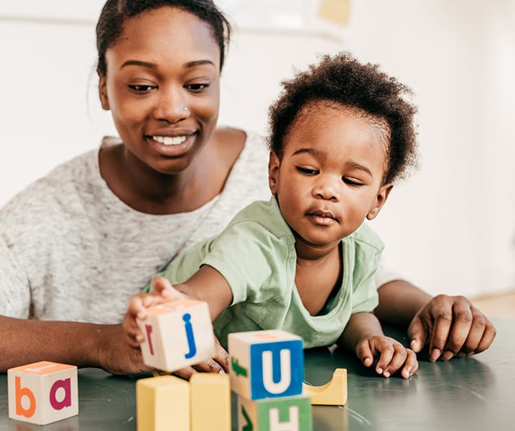 Baby playing wiht her mother