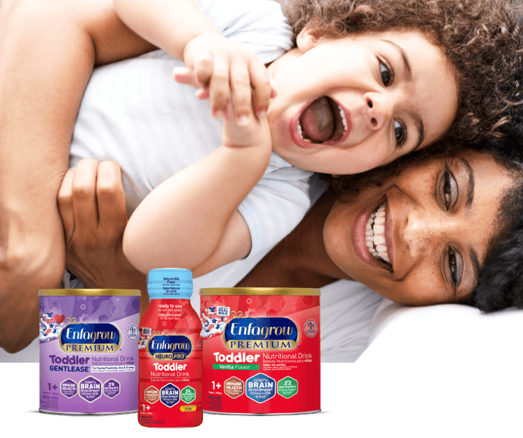 Laughing mom and toddler with a lineup of toddler nutritional drinks